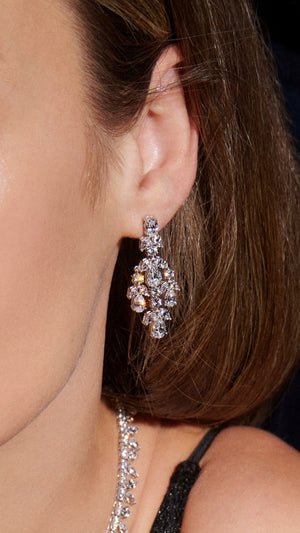 Chandelier white gold earrings featuring a cluster of pears and marquise-cut stones