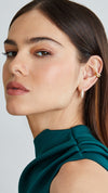 Trendy stacked gold earring look with pavé hoop earrings