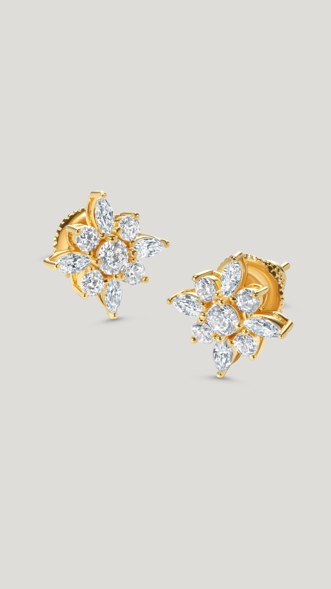 Snowflower studs set in Sterling Silver with a gold vermeil finish. Flower inspired stud earrings for women.