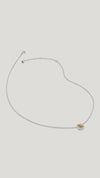 Pendant necklace for women with a round brilliant light yellow stone surrounded by a delicate halo of borderset details.