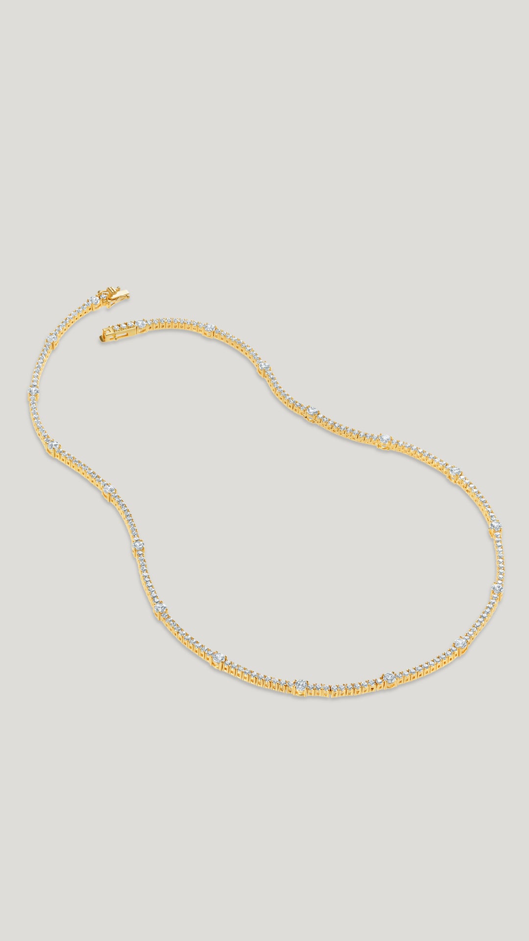 Phoebe unique tennis necklace for women with precision cut round brilliant stones.