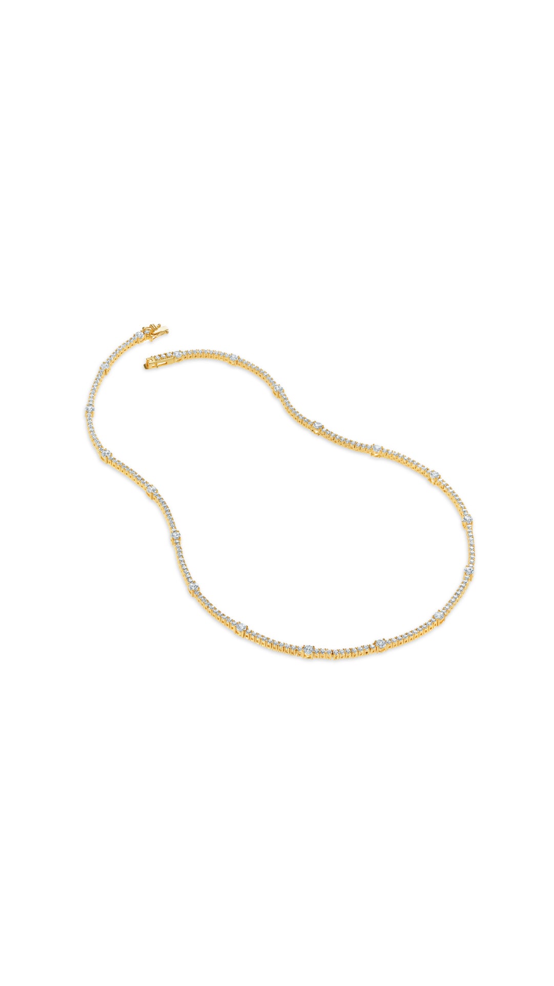 Effortlessly refined take on the classic gold tennis style necklace, featuring brilliant stones punctuated with larger round keystones.