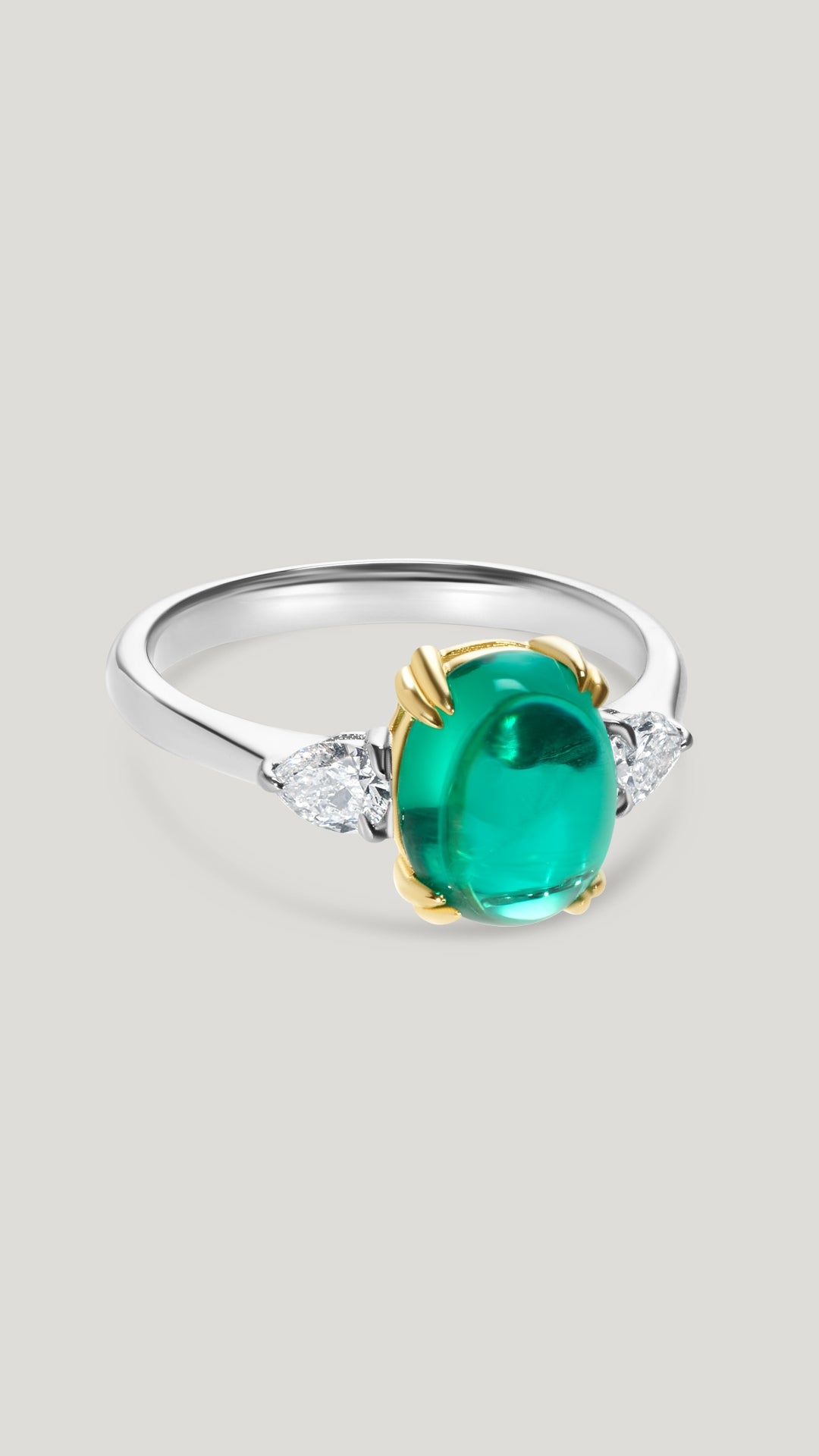 Cabochon cut emerald ring for women with lab-grown diamond pear stones