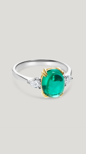 Cabochon cut emerald ring for women with lab-grown diamond pear stones