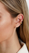 Ear stack inspiration with gold hoops, studs, and cuffs