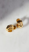 Three tier croissant style gold hoops for women.