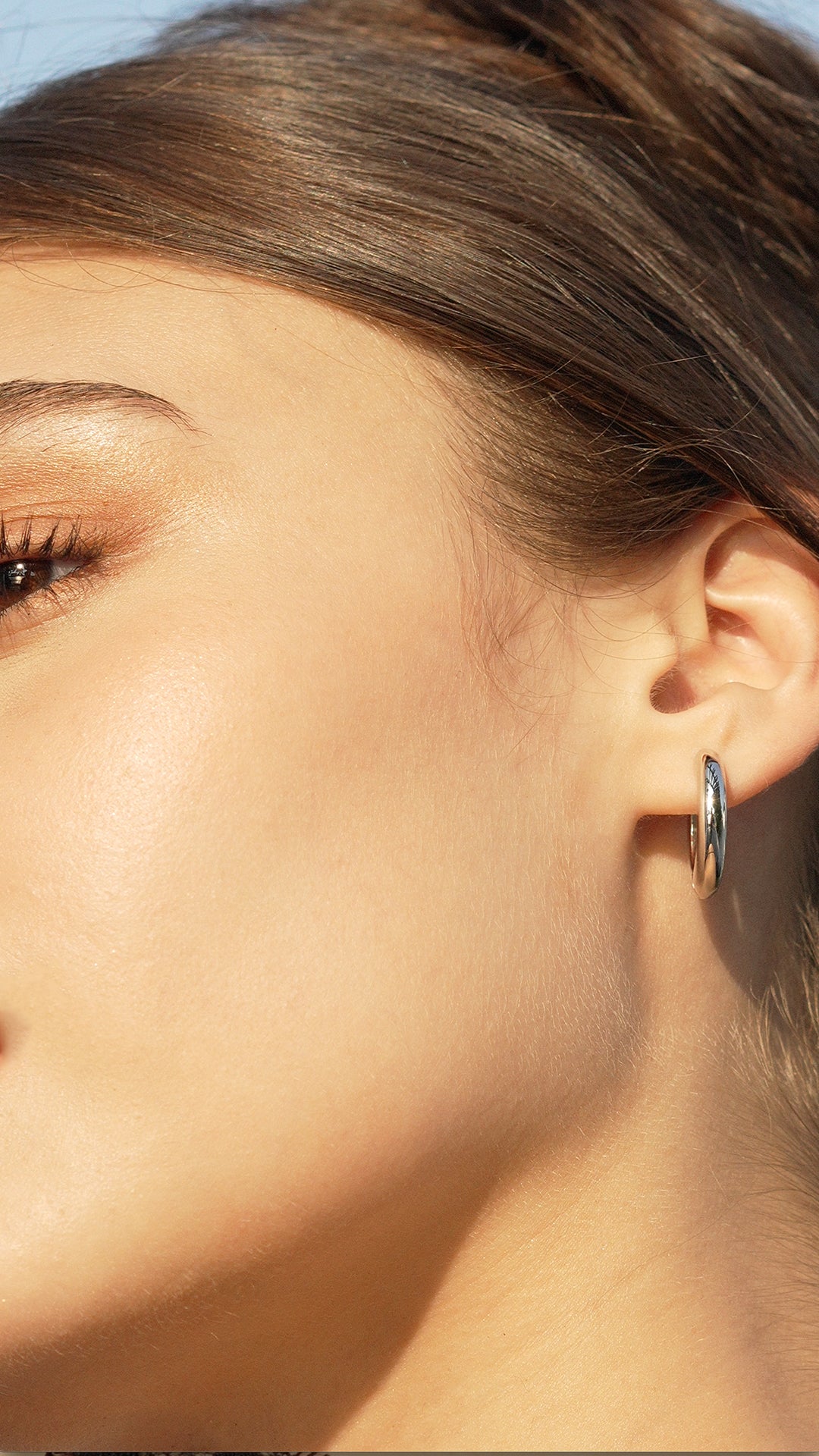 Lightweight everyday hoops crafted with a high-shine white gold finish for effortless elegance.