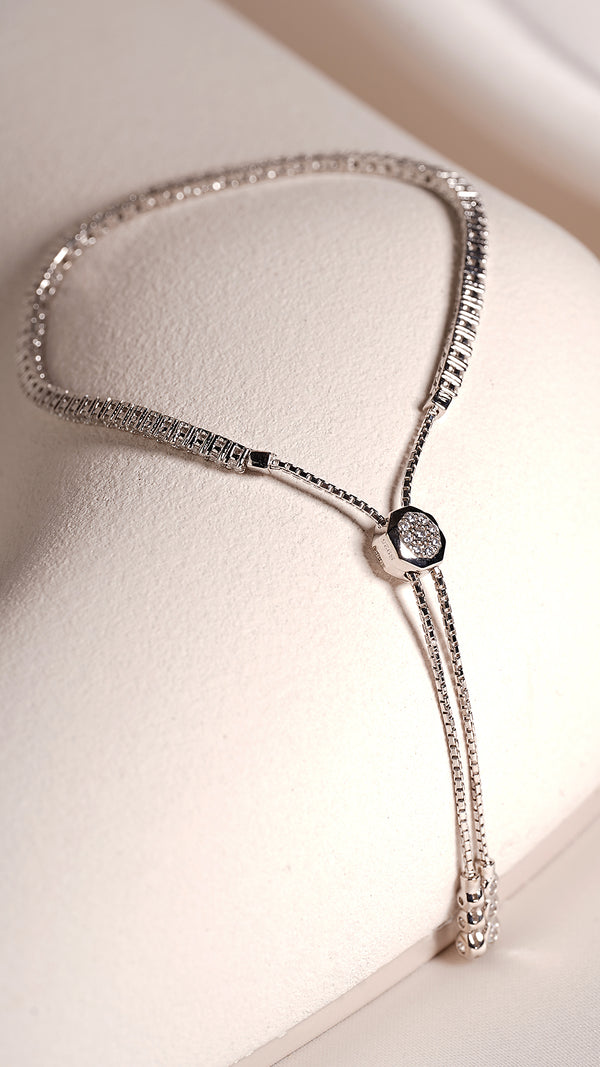 Modern adjustable tennis bracelet for layering, timeless design.