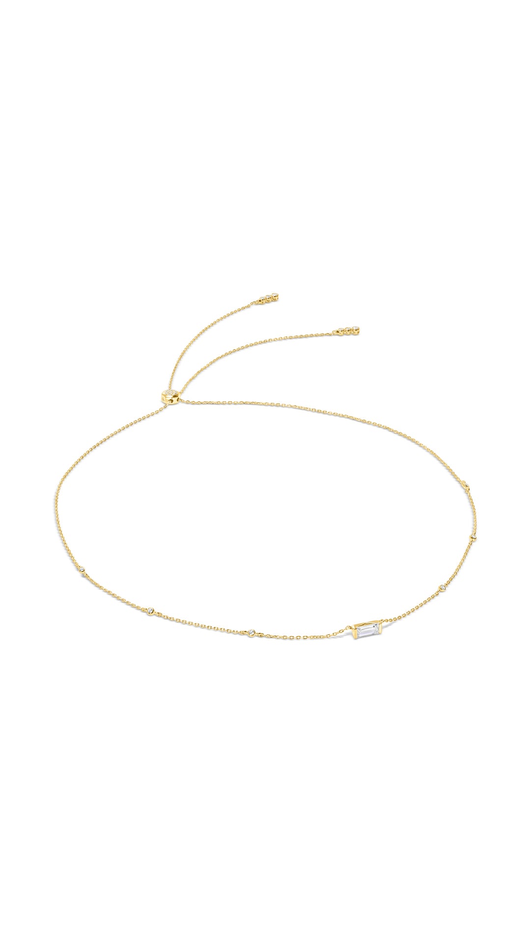 Everyday gold station necklace for women featuring a single baguette-cut stone in a bezel setting with delicate chain detail.