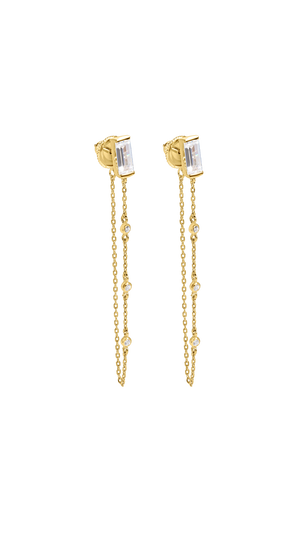 Gold earrings for women featuring a single baguette cut stone in a bezel setting with a delicate chain detail.