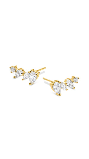 Gold earrings for women featuring a cluster of beautiful pear, marquis, and round stones finished in 18K yellow gold vermeil. 