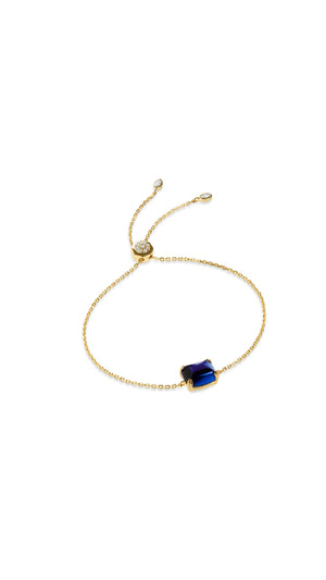 Gold slider bracelet for women with recycled sapphire stone from the Sugardrop collection.