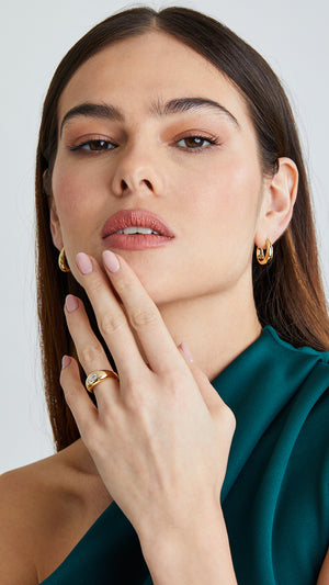 Gleaming emerald-cut gemstone at the heart of this sterling silver and gold vermeil signet ring for a bold statement look.