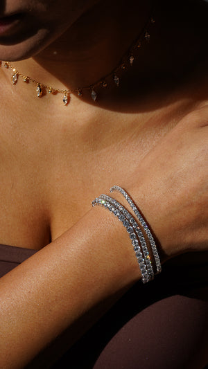 White gold-plated sterling silver tennis bracelet, available in three sizes.