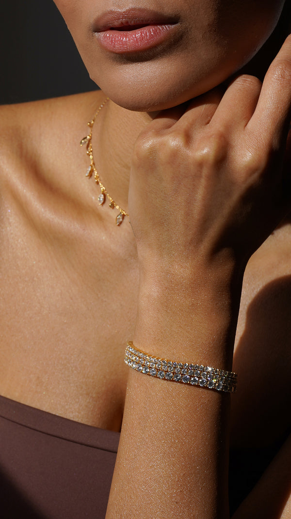 Ladies gold tennis bracelet stack. The ultimate gold tennis bracelets for those who love understated luxury.
