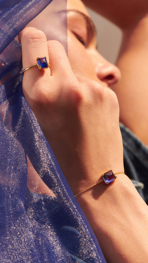 Gold vermeil slider bracelet for women with matching sterling silver ring made from lab-grown recycled tanzanite. 