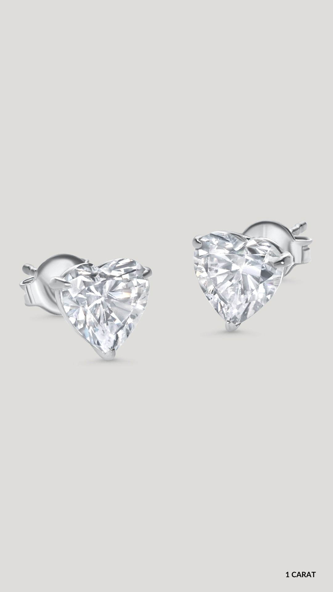 White gold plated sterling silver 1ct heart studs for women.